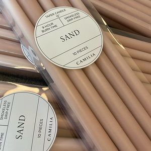 Camilia taper candles in SAND